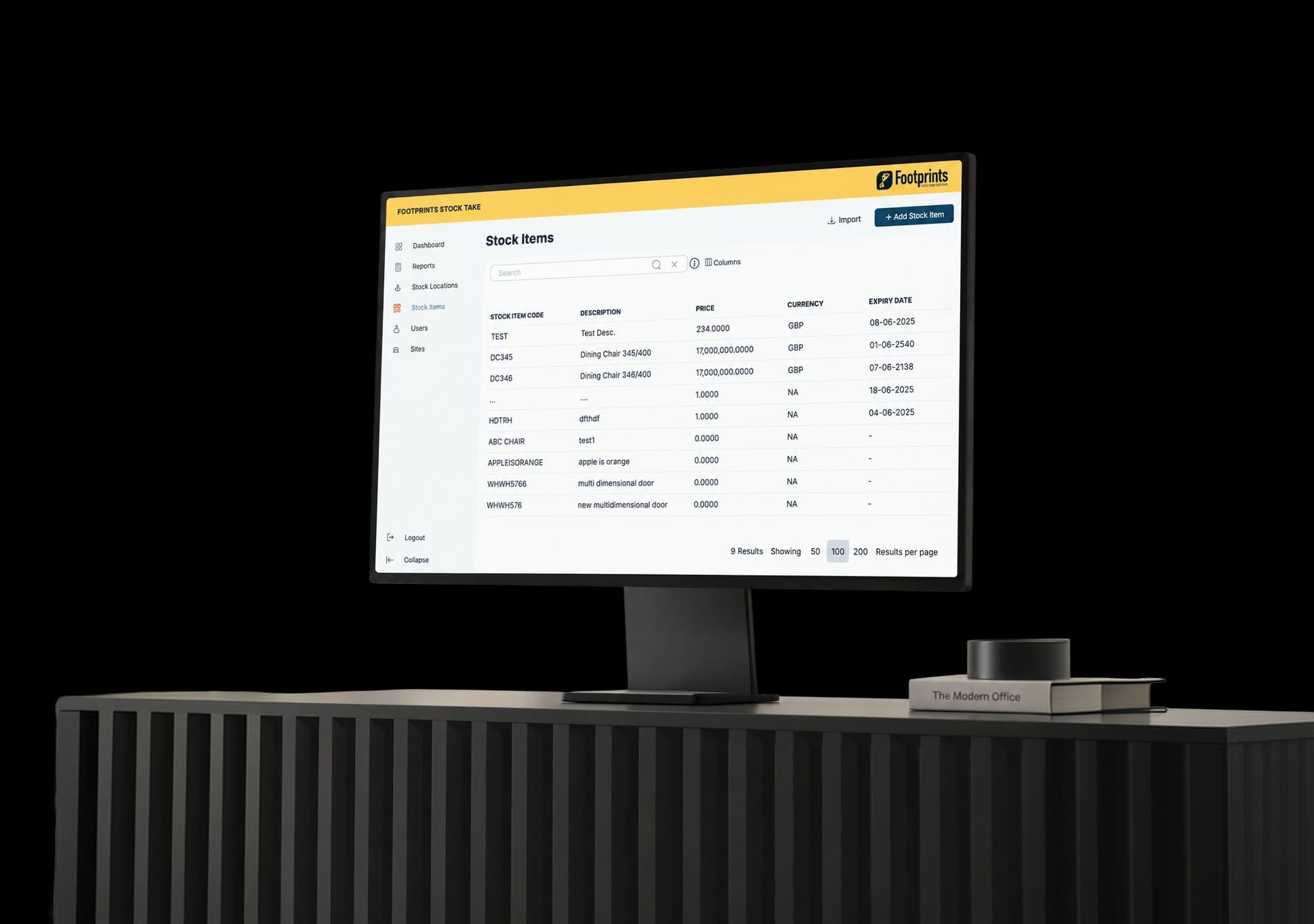 A desktop monitor on a dark desk showing the Footprints Stock Take screen, a list of stock items with codes, prices and expiry dates